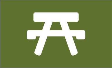 picnic table icon on green background